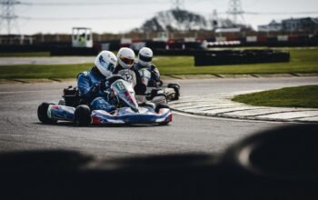 three person racing in go-kart