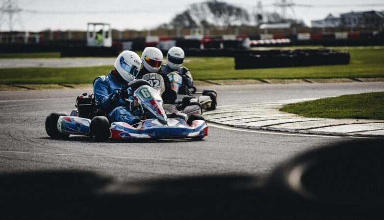 three person racing in go-kart